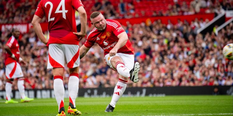 In a charity game at Old Trafford, Wayne Rooney stole the show with a free kick but Celtic legends beat Manchester United Legends.