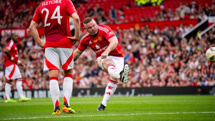 In a charity game at Old Trafford, Wayne Rooney stole the show with a free kick but Celtic legends beat Manchester United Legends.