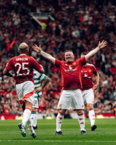 In a charity game at Old Trafford, Wayne Rooney stole the show with a free kick but Celtic legends beat Manchester United Legends.
