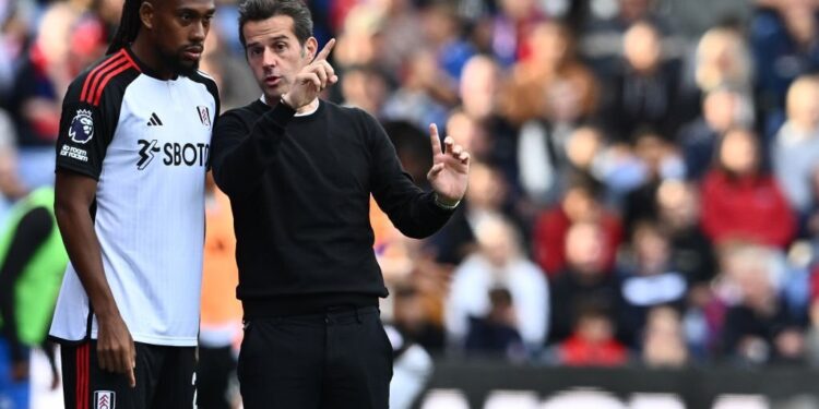 LONDON, ENGLAND - SEPTEMBER 23: Alex Iwobi and manager Marco Silva of Fulham during the Premier League match between Crystal Palace and Fulham FC at Selhurst Park on September 23, 2023 in London, United Kingdom. (Photo by Sebastian Frej/MB Media/Getty Images)