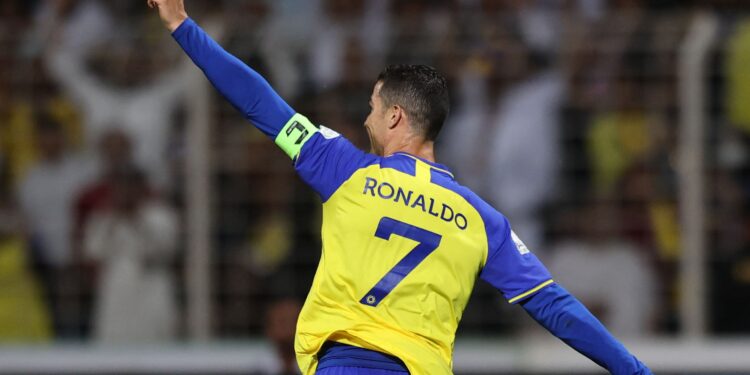 Nassr's Portuguese forward Cristiano Ronaldo celebrates scoring his team's fourth goal the Saudi Pro League football match between Al-Wehda and Al-Nassr at the King Abdulaziz Stadium in Mecca on February 9, 2023. (Photo by AFP)