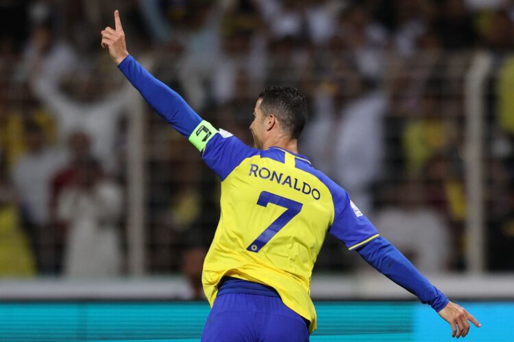 Nassr's Portuguese forward Cristiano Ronaldo celebrates scoring his team's fourth goal the Saudi Pro League football match between Al-Wehda and Al-Nassr at the King Abdulaziz Stadium in Mecca on February 9, 2023. (Photo by AFP)