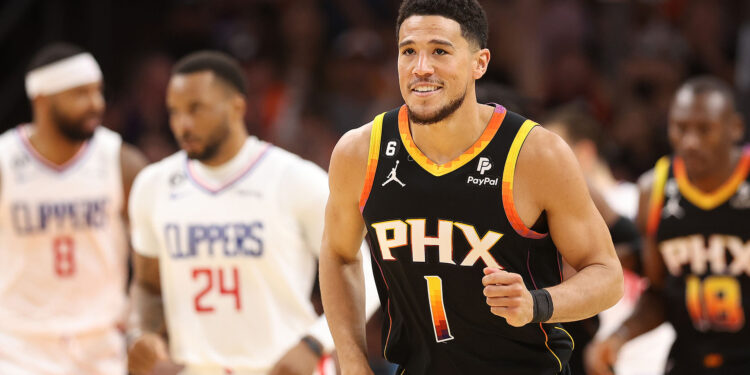 PHOENIX, ARIZONA - APRIL 25: Devin Booker #1 of the Phoenix Suns reacts during the second quarter against the LA Clippers in game five of the Western Conference First Round Playoffs at Footprint Center on April 25, 2023 in Phoenix, Arizona. NOTE TO USER: User expressly acknowledges and agrees that, by downloading and or using this photograph, User is consenting to the terms and conditions of the Getty Images License Agreement. (Photo by Christian Petersen/Getty Images)