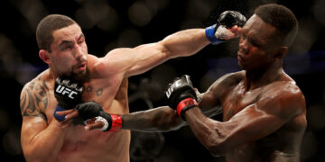 Adesanya pictured with Whittaker in unexpected collab