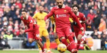 Liverpool edges past Wolves to extend Premier League lead