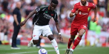 Arsenal battle back to hold champions Liverpool in Anfield thriller